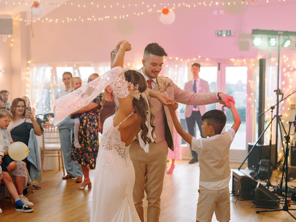 Bride, groom, and son share a dance at Knockerdown