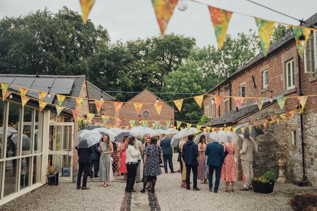 Image showing wedding guests celebrating in the street at Knockerdown Cottages.