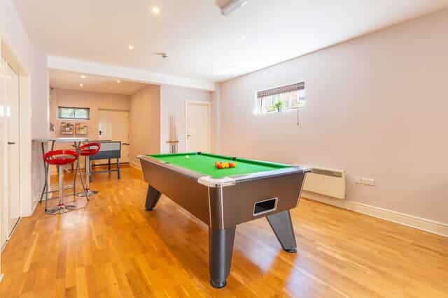 Games room with a pool and football table
